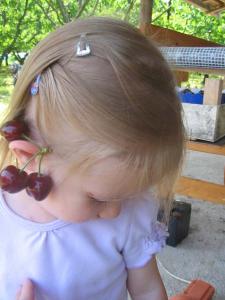 Cherries on her ears